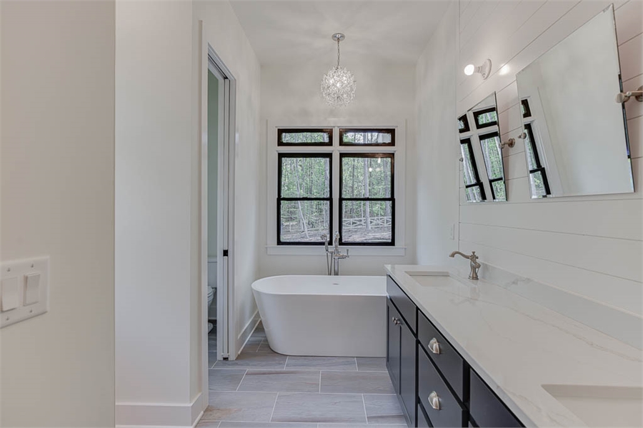 the main-level ensuite bathroom in a spacious two-story farmhouse