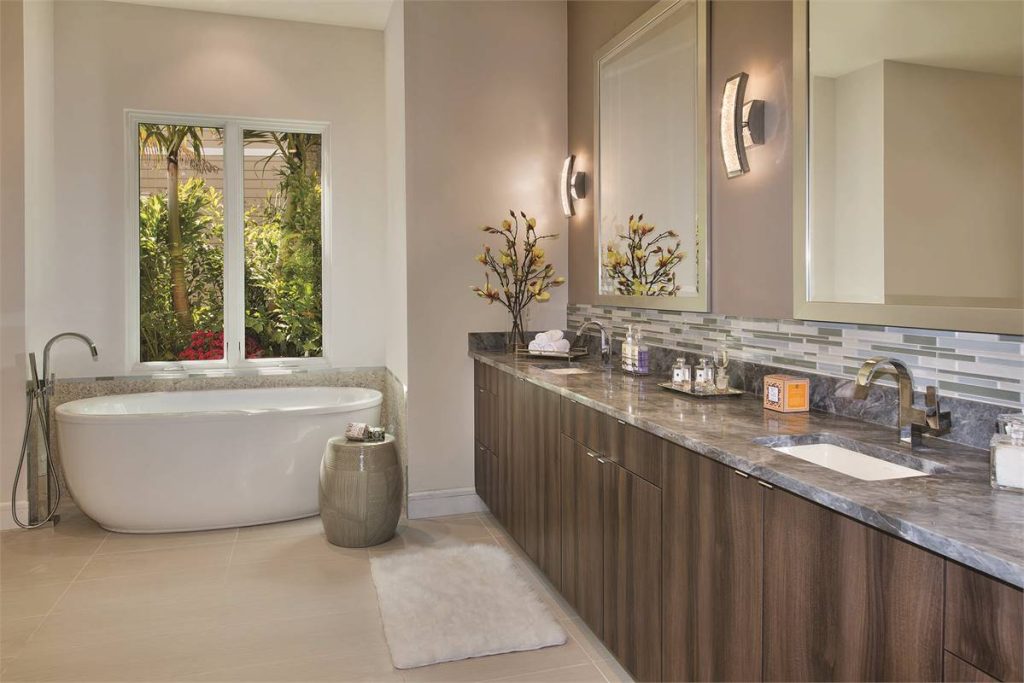 the dual vanity and soaking tub in a primary ensuite