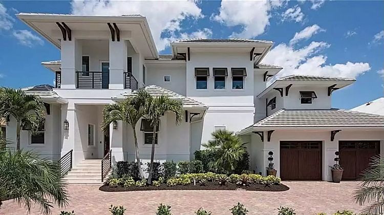 A Luxurious Two-Story Mediterranean Home with Balconies and Four Bedroom Suites