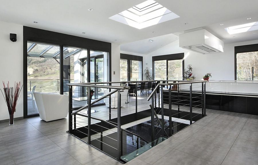 A Modern Living Space with a Flat Roof Skylight with Curved Glass